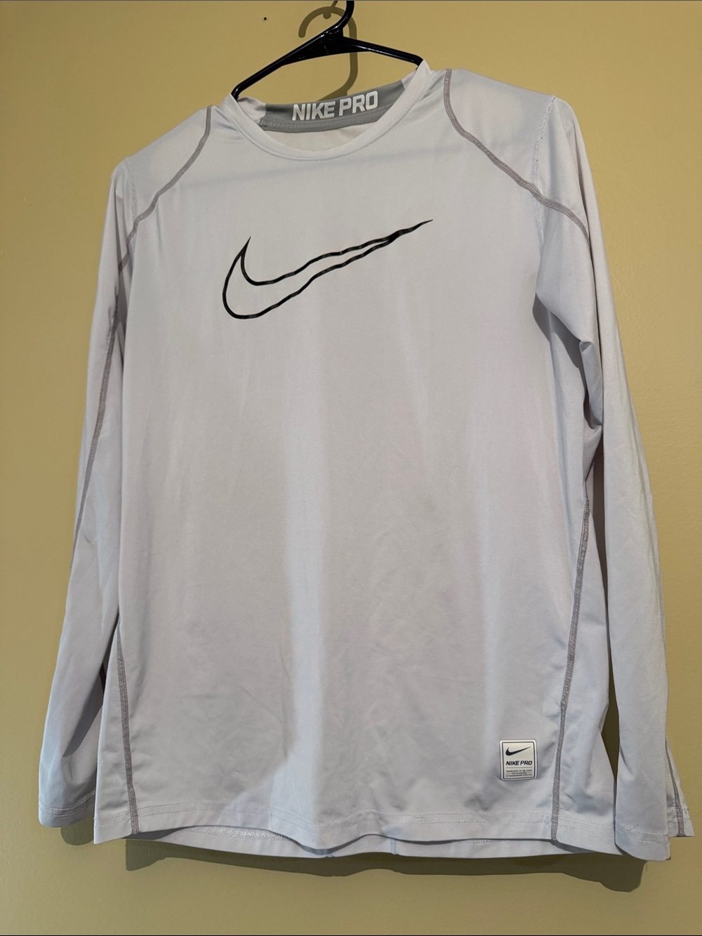 Nike White Long Sleeve Dri-FIT Tee with Black Swoosh